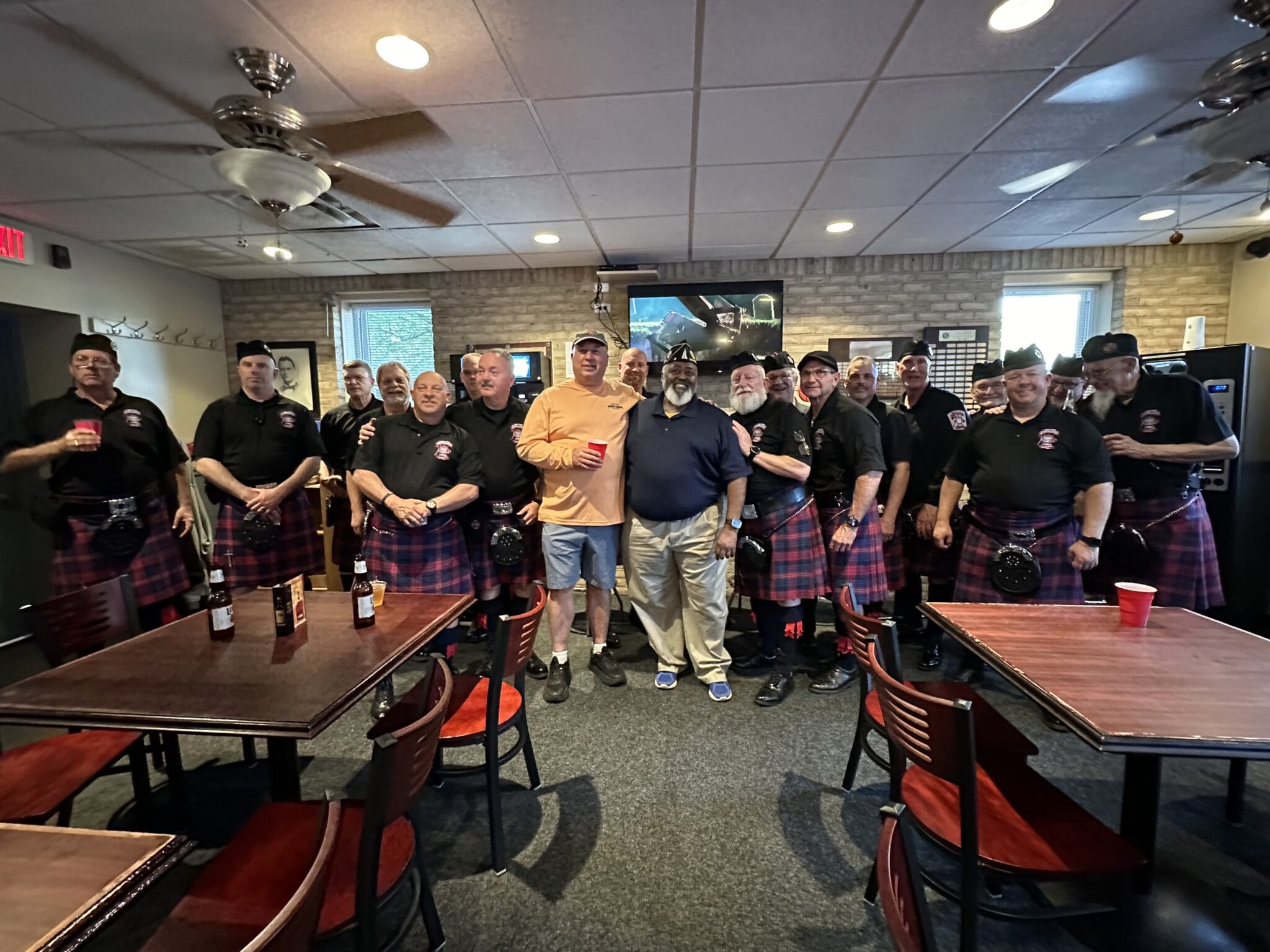 Executive Board member and Business Agent Gregg Allgeier is pictured with members of the Metro Detroit Police and Fire Pipes and Drums and First Vice Commander Dwyane McQueen of the American Legion's Kenneth H. Nash D.C. of Post #8. | National Police Week 2024